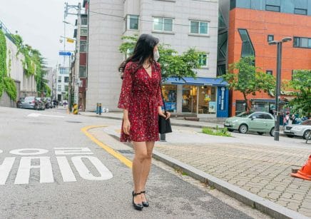 Korean woman wearing short red dress and high heels
